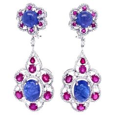 Indigo Collection Tanzanite, Ruby and Rose cut Diamond dangling earrings in 18k white gold. Tanzanite: 26.30ct total weight. Ruby: 10.11ct total weight. Diamonds: 3.66ct total weight. All diamonds are G-H/SI stones. Victor Wallpaper, Diamond Dangling Earrings, Ruby And Diamond Earrings, Magnificent Jewels, Nice Nails, Precious Jewels, Women Diamond, Ruby Diamond, Dangling Earrings