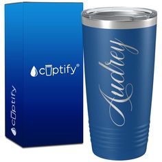 a blue tumbler cup next to a box for the cuptivy logo on it