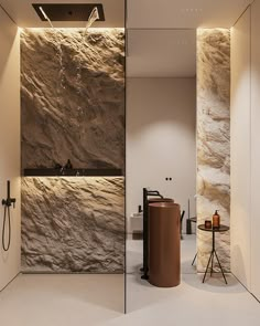 a modern bathroom with stone walls and flooring