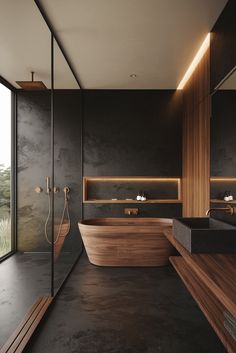 a bathroom with a large wooden tub next to a walk in shower and two sinks