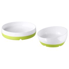 two white bowls with green rims sitting side by side