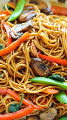 stir fry noodles with mushrooms, carrots and peppers