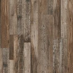 the wood flooring is brown and has many different types of planks on it