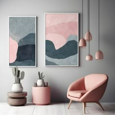 two paintings hang on the wall next to pink chairs and cacti