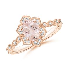 a pink diamond ring with white diamonds on the band and an oval shaped center stone