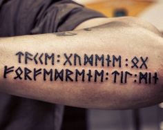 a man with a tattoo on his arm that has roman numerals in it