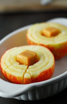 an apple sliced in half and sitting in a bowl