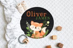 an image of a baby's name plate with a fox and leaves on it