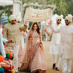 Bride Himanshi is casting a spell on everyone with her breathtaking bridal entry in a lovely pastel lehenga and minimal makeup. Swipe to see more beautiful wedding photos from Himanshi & Rahul's wedding ceremony. ❤ Bride: @himanshipashine Photographer: @safarnamafilms Bride outfit- @anushreereddydesign Groom outfit- @royaltybyhardikjain Makeup & Hair- @makeupbyharmanjatana Jewelry- @jewellery_by_kirankhan Follow @wishnwed for more such beautiful Indian wedding inspiration #celebritywedding #wishnwed #indianweddings #weddinginspiration #bridalentry #phoolonkichadar #pastellehenga #indianweddingphotos #brideentry ( bridal outfits , wedding outfits , gold jewellery , pastel wedding lehenga, phoolon ki chadar, indian bridal entry, Indian wedding dress , indian wedding photos ) Bridal Lehenga Minimal, Flower Chaddar For Bridal Entry, Phool Chadar For Bride, Floral Chaddar Bride Entry, Phoolon Ka Chaddar Ideas, Flower Chaddar For Bride, Bride Brother Outfit Indian, Phoolon Ka Chaddar, Phool Chadar