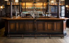 an old fashioned bar with lots of bottles on it