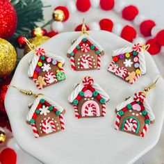 decorated gingerbread houses on a white plate