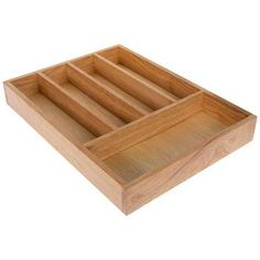 a wooden tray with three compartments on it