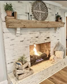 a fireplace with a clock above it and some books on the mantle next to it