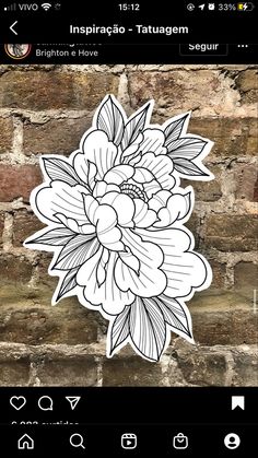 a flower sticker sitting on top of a brick wall