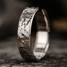 a close up view of a wedding ring on a table