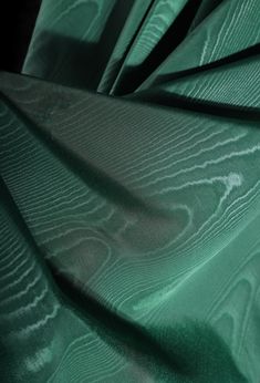 close up view of green fabric with wavy lines