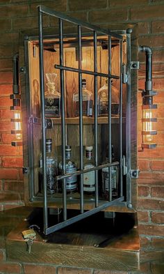 an old jail cell with bottles in it and lights hanging from the wall next to it