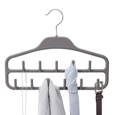 a coat rack with two ties hanging from it's hooks and one tie on the hanger