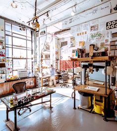 a room filled with lots of clutter and wooden shelves covered in magnets on the walls