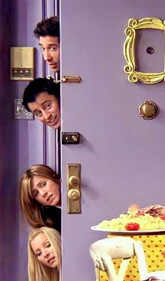 the cast of friends hanging out in front of a door with their faces on it