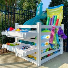 an outdoor play area with toys and water slides