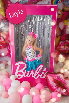 a photo frame with balloons and confetti in the background for a barbie birthday party