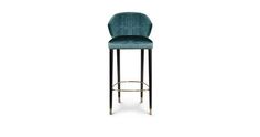 an upholstered bar stool with a black metal frame and green velvet seat, against a white background