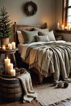 a bed with blankets and candles on top of it next to a wooden barrel filled with pine cones