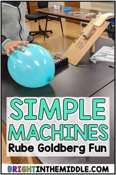 a blue balloon sitting on top of a table with the words simple machines in front of it