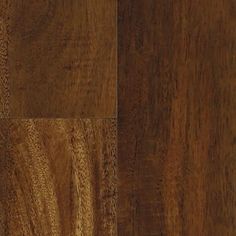 a close up view of a wood floor with dark brown stain on the top and bottom