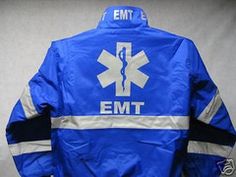 an emt blue and white jacket with the ems symbol on it's chest