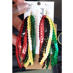 We at Molasseshoops Pride Ourselves On Designing & Finding Affordable Unique High-Quality Fashion Products. We Design For All Of Mankind!! 🌍 ⚠️ WARNING OUR PICTURES DON'T JUSTIFY THE SPARKLE IN THESE CELEBRATION BEAUTIES⚠️ Introducing Our One Of A Kind Juneteenth Unique Beauties️ These Sequin Beauties Are Full Of Layers Yet Extremely Lightweight yet Eye Catching & Flowly   AVAILABLE  IN 2 DANGLE SIZES: *SHORTIES: 2.2 INCHES *LONG: 4.6 INCHES  (Ear Lobe to Jaw Line) Silver Fish Hook Attachment Multicolor Tassel Earrings For Summer Festival, Colorful Beads Tassel Earrings For Festival, Juneteenth Bracelet Ideas, Multicolor Tassel Earrings, Juneteenth Earrings, Quality Fashion, Sport Event, Tassel Earrings, Tassels