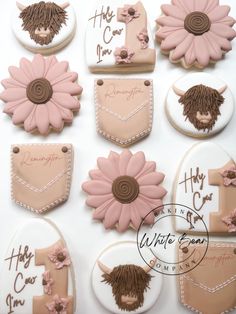 decorated cookies are arranged in the shape of farm animals and flowers with names on them