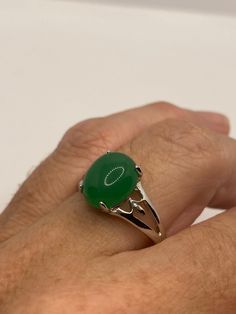 Vintage Lucky Green Nephrite Jade Cocktail Ring Large green nephrite jade Vintage ring, does not tarnish Size 6.5, 7, 8, or 9.25 All rings are shipped free in the US in a nice gift box. Check out our over a THOUSAND great reviews Engraving is $4 per letter and is not always perfect depending on the piece. It can take a few days if the jeweler is busy. This is payable to Paypal Judithsltd@gmail.com Green Oval Opal Ring With Polished Finish, Oval Green Rings With Polished Finish, Green Oval Cabochon Ring For Gift, Green Emerald Oval Cabochon Ring, Green Emerald Ring With Oval Cabochon, Green Opal Open Ring Gift, Green Opal Open Ring For Gifts, Green Opal Open Ring As Gift, Emerald Healing Ring