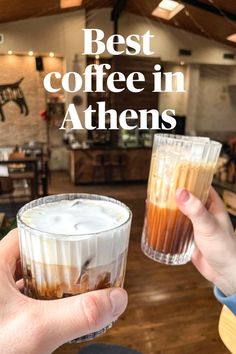 two people holding drinks with the words best coffee in athenes