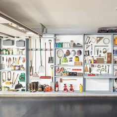 a garage filled with lots of tools and shelves full of hanging items on the wall