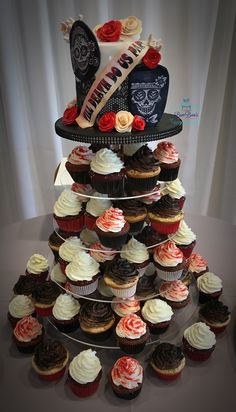 cupcakes are stacked on top of each other in the shape of a tower