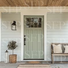 a front porch with a bench and lamp on the side walk next to a door