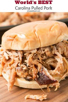 a pulled pork sandwich on a cutting board with the words world's best carolina pulled pork