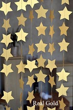 some gold stars hanging from the ceiling