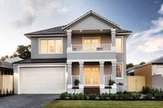 a two story house with white trim and windows