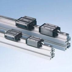 three different types of linear rails on a blue background