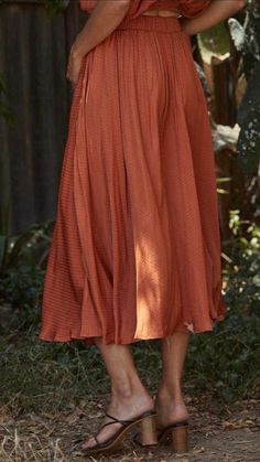 Even though this Woven Satin Long Midi Skirt is a pre-fall piece, it can be worn year round. This beautiful satin silk skirt has that perfect classic fit. Orange-color. Lined. Satin fabric. Side pockets. Full circle skirt. Woven Satin Long Midi Skirt fits true to size. By Together LA. **Skirt for sale only, top not available. Woven Satin Long Midi Skirt Measurements: Small measures 30" overall length. Medium measures 31" overall length. Large measures 32" overall length. 100% Poly, lining 100% R Silk Long Skirt For Fall, Silk Flared Pleated Skirt For Summer, Summer Silk Flared Pleated Skirt, Silk Pleated Flared Skirt For Summer, Silk Lined Skirt For Fall, Silk Midi Skirt Bottoms For Fall, Flowy Silk Skirt For Fall, Pleated Silk Midi Skirt, Relaxed Silk Skirt For Fall