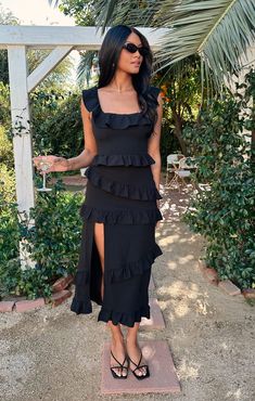 This fitted midi dress is as flattering as it is comfortable! Ruffled to perfection, this black dress isn't your everyday midi! A square neckline and tank top straps lay the foundation for a simple silhouette, while dainty details including a slit to elevate it. Show up and show out at all this seasons events. Black Wedding Guest Dress Summer, Black Dress For A Wedding, Black Ankle Length Dress, Black Wedding Guest Dresses, Black Tie Wedding Guest Dress, Greta Dress, Black Summer Dress, Smith Wedding, Neutral Dress