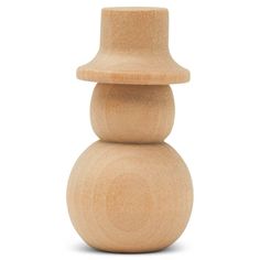 a wooden toy sitting on top of a white surface