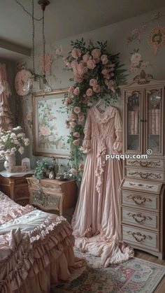 an old fashioned bedroom with pink flowers on the wall and antique furniture in the corner