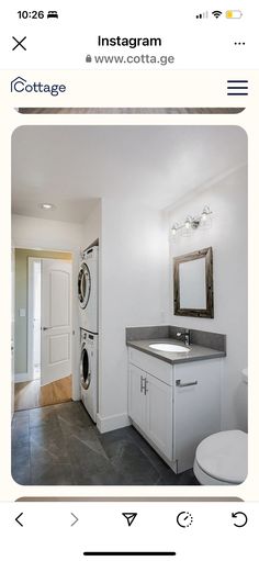 a bathroom with a washer and dryer in it