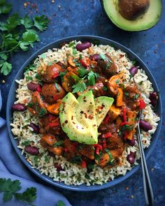 a bowl filled with rice, beans and avocado