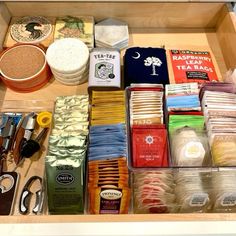 a drawer filled with lots of different types of crafting supplies and items to make it look like something out of a book