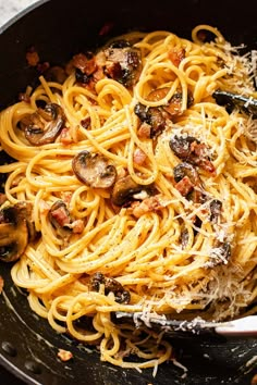 pasta with mushrooms and parmesan cheese in a skillet